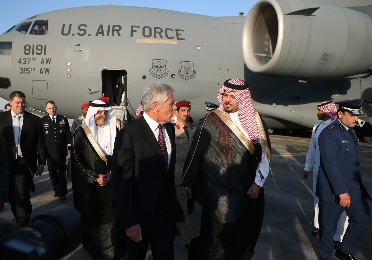U.S. Secretary of Defense Chuck Hagel, left, is greeted by Deputy Defense Minister Salman bin Sultan bin Abdulaziz, right, after he arriving at Riyadh Air Base on Monday, Dec. 9, 2013 in Riyadh, Saudi Arabia.