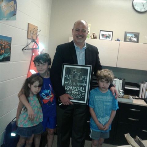 Edmonton principal Dave Kowalchuk, with Shelley Miscavitch-Lange’s children.