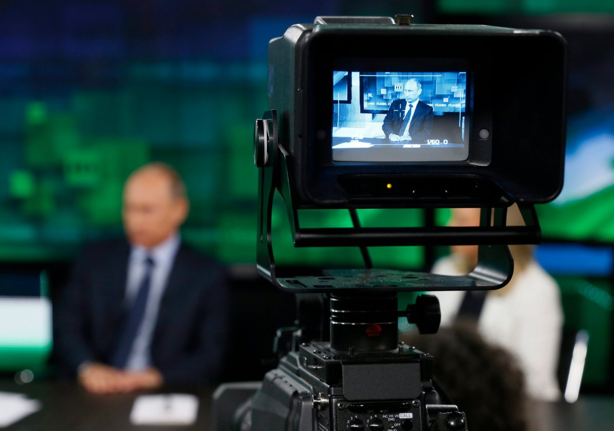 In this Tuesday, June 11, 2013 file photo, Russian President Vladimir Putin is shown on the screen of a camera viewfinder at the new headquarters of "Russia Today" television channel in Moscow, Russia. 