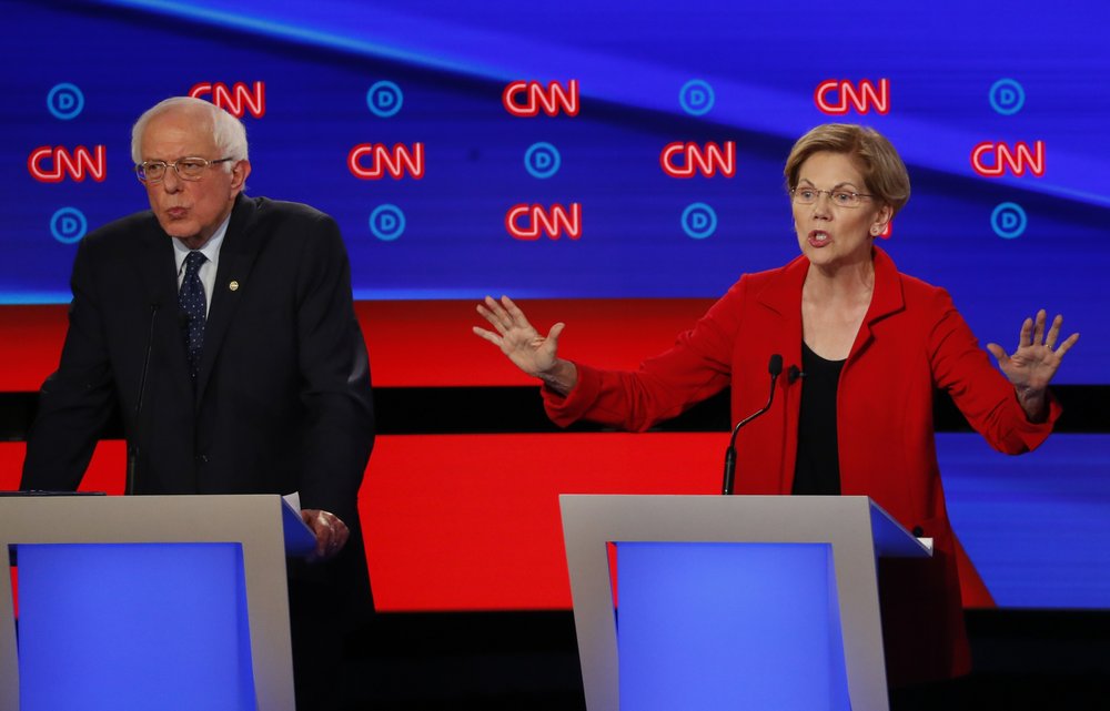 Sen. Bernie Sanders, I-Vt., and Sen. Elizabeth Warren, D-Mass., participate in the first of two Democratic presidential primary debates hosted by CNN Tuesday, July 30, 2019, in the Fox Theatre in Detroit. 