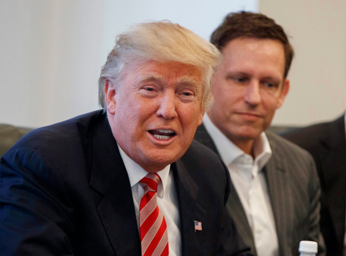 Peter Thiel, right, listens as then President-elect Donald Trump speaks during a meeting with technology industry leaders at Trump Tower in New York.  