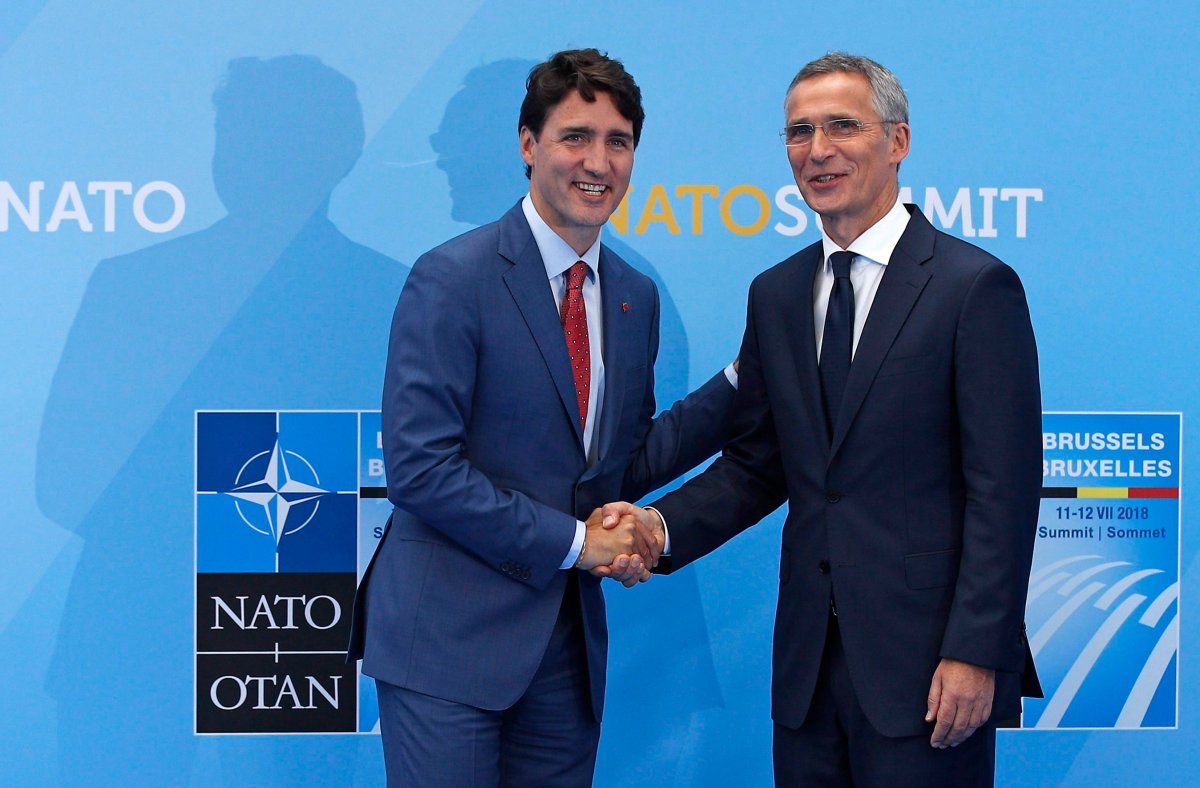 Prime Minister Justin Trudeau, left, is greeted by NATO Secretary General Jens Stoltenberg before a summit of heads of state and government at NATO headquarters in Brussels on Wednesday, July 11, 2018. 