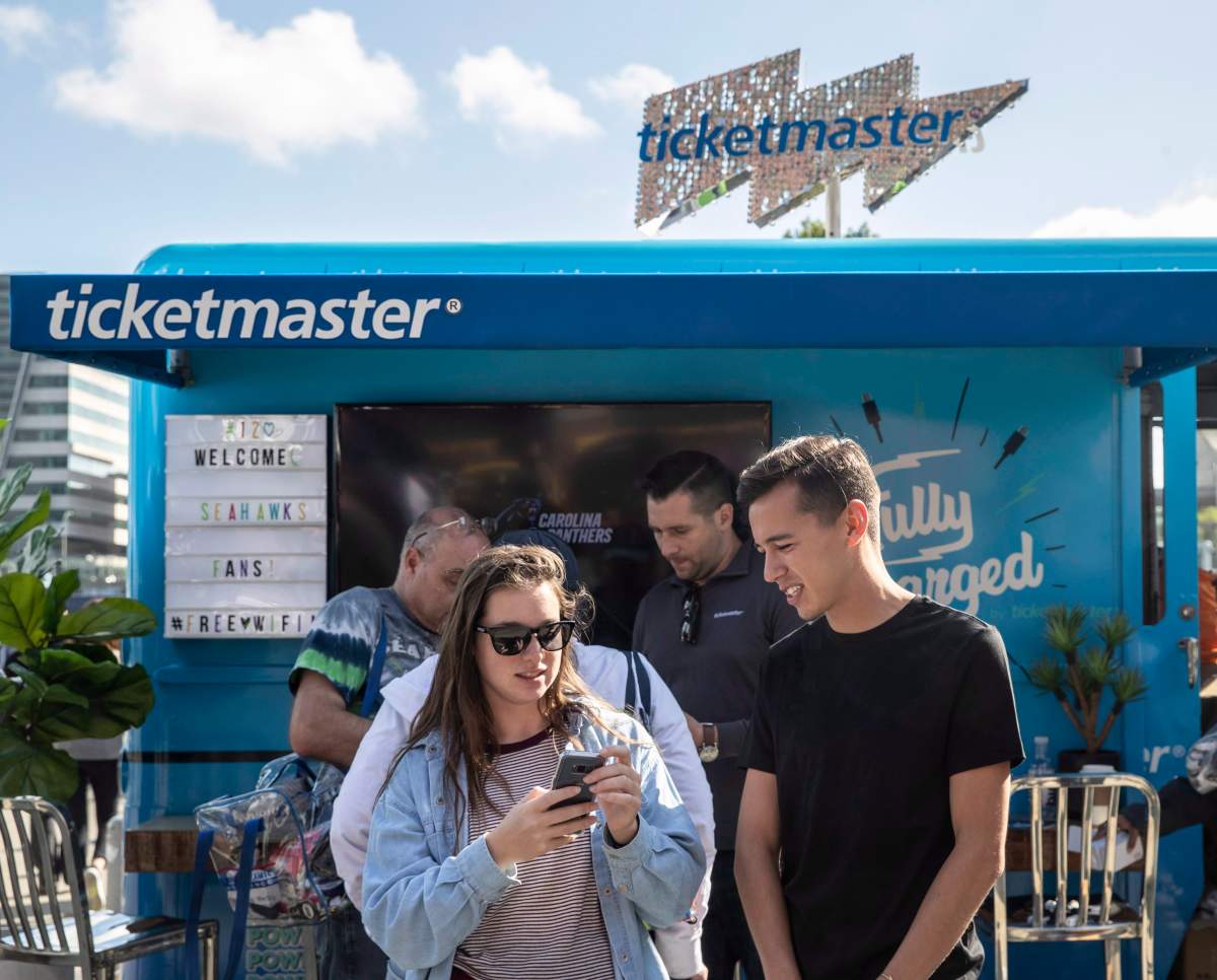 Ticketmaster helps fans get their digital tickets ready on their mobile devices for the Seahawks home opener at CenturyLink Field on Sunday, Sept. 23, 2018, in Seattle, Wash.