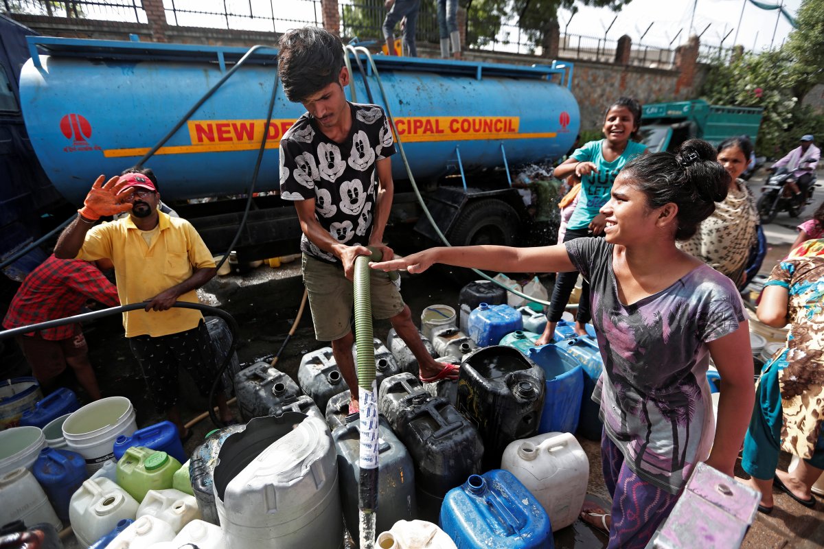 Residents fill their containers with drinking water from a municipal tanker in New Delhi, India, June 28, 2019. Picture taken June 28, 2019.