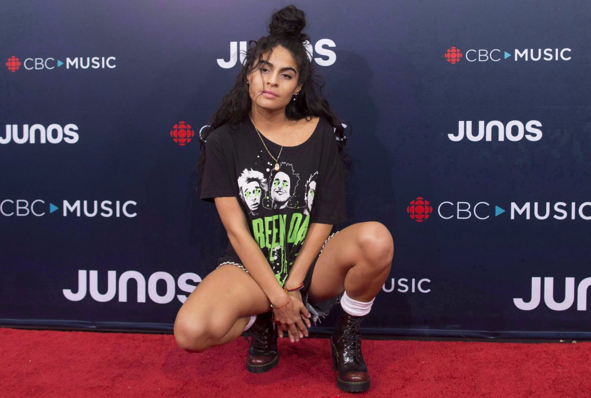 Jessie Reyez arrives on the red carpet at the Juno Awards in Vancouver, Sunday, March, 25, 2018. Reyez is sitting out a performance at the 2019 Ottawa RBC Bluesfest as she heals from a recent leg injury.