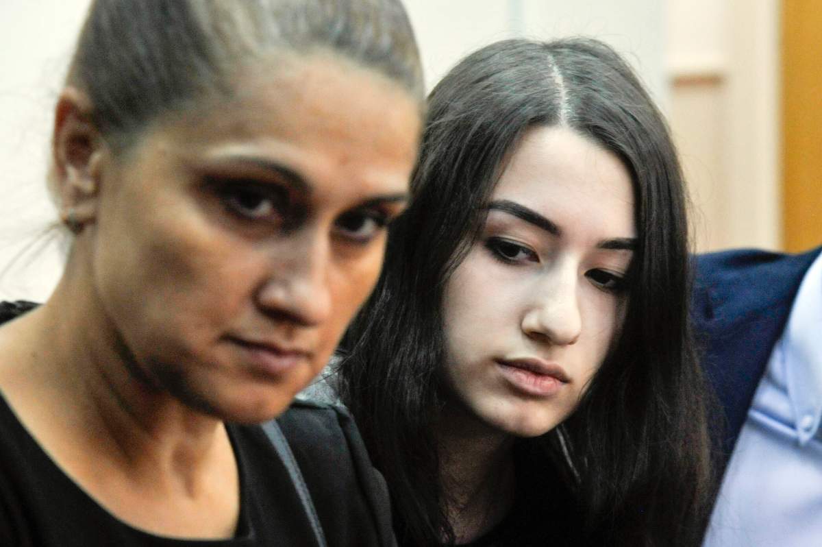 On Wednesday, July 26, 2019, Krestina Khachaturyan, right, and her mother Aurelia Dunduk attend hearings in a court room in Moscow, Russia. (Alexander Avilov, Moscow News Agency photo via AP)
