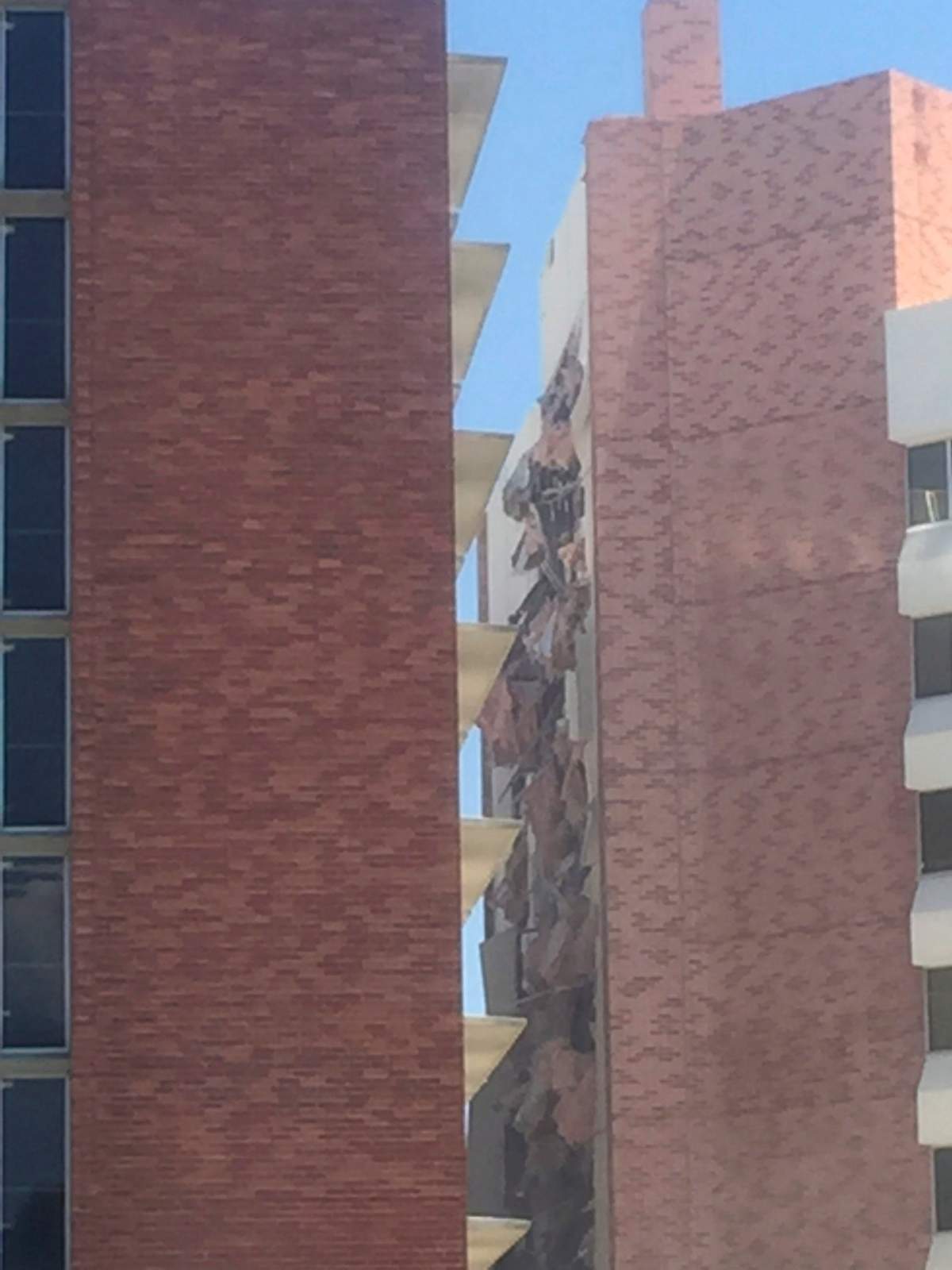 The aftermath of an explosion inside a residence hall at the University of Nevada, Reno in Reno, Nev., is visible on Friday, July 5, 2019.