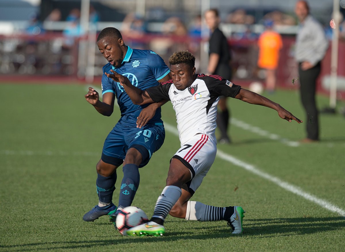 Ottawa Fury FC's Chriastiano Francois, right, vies for control of the ball with HFX Wanderers FC's Ndzemdzela Langwa in first half Canadian Championship soccer action in Halifax on Wednesday, July 10, 2019.