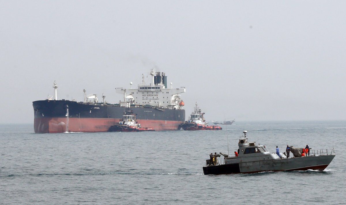 (FILE) - An Iranian military boat patrols next to the Artavil oil tanker, at the Kharg Island, in Persian Gulf, southern Iran, 12 March 2017.