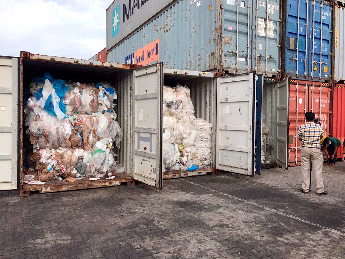 In this Tuesday, July 16, 2019, photo, containers loaded with plastic waste are placed at country beach city, Sihanoukville Port, southwest of Phnom Penh, Cambodia. 