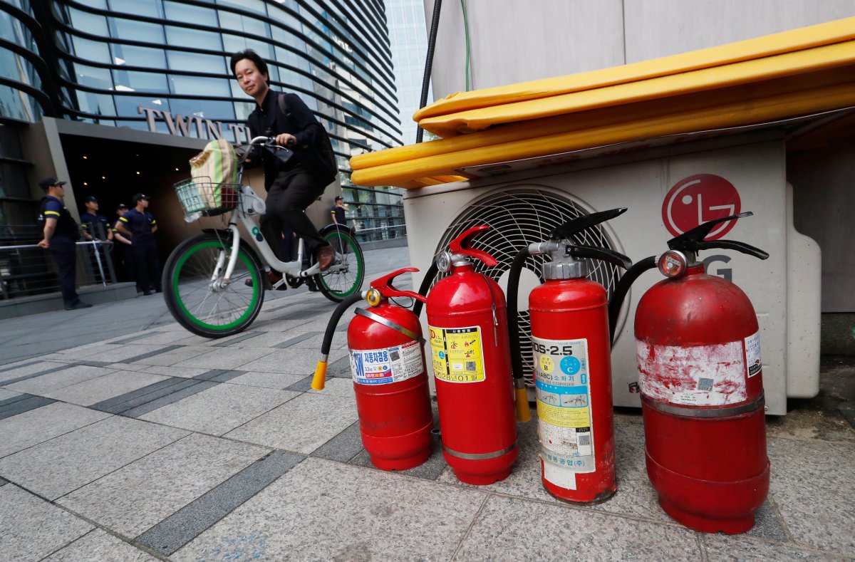 Fire extinguishers are placed near a building where the Japanese embassy is located in Seoul, South Korea, Friday, July 19, 2019. 