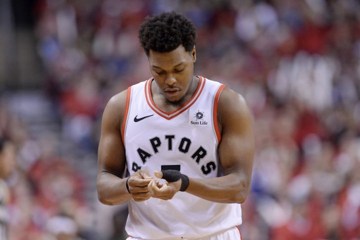 Toronto Raptors guard Kyle Lowry (7) looks at his thumb as he heads to the bench after fouling out of the game during the second half of Game 3 NBA Eastern Conference finals basketball action against the Milwaukee Bucks in Toronto on Sunday, May 19, 2019.