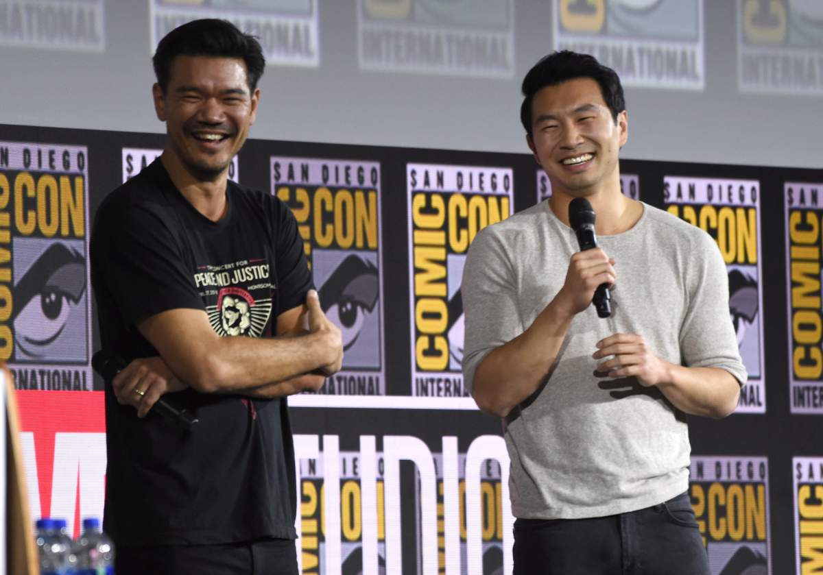 Destin Daniel Cretton, left, and Simu Liu speaks during the "Shang-Chi and The Legend of the Ten Rings" portion of the Marvel Studios panel on day three of Comic-Con International on Saturday, July 20, 2019, in San Diego. 