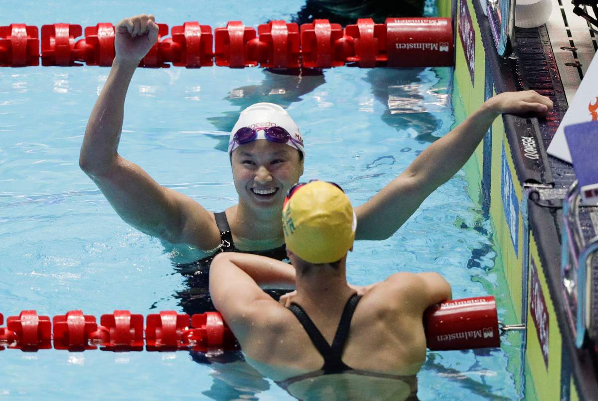 Canada’s Margaret MacNeil reacts after winning the women’s 100m butterfly final at the World Swimming Championships in Gwangju, South Korea, Monday, July 22, 2019. (AP Photo/Mark Schiefelbein)