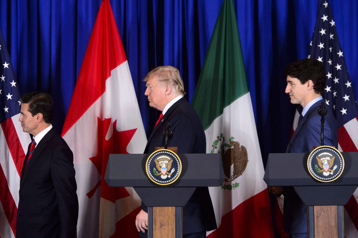 Prime Minister Justin Trudeau participates in a signing ceremony for the new United States-Mexico-Canada Agreement with President of the United States Donald Trump and President of Mexico Enrique Pena Nieto in Buenos Aires, Argentina on Friday, Nov. 30, 2018. 