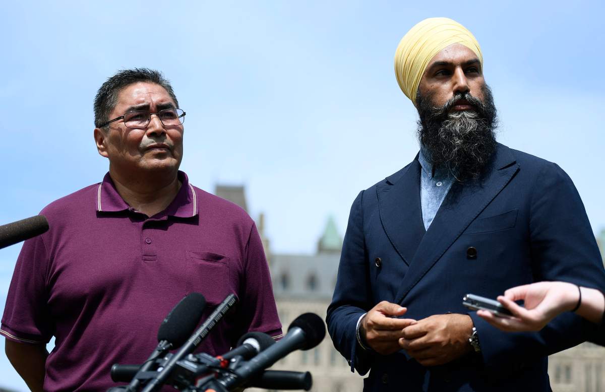 NDP leader Jagmeet Singh, right, and Chief Rudy Turtle of the Grassy Narrows First Nation listen to questions during a press conference announcing his candidacy for the NDP in Kenora, Ont. for the fall election, on the lawn of Parliament Hill in Ottawa on Monday, July 29, 2019.