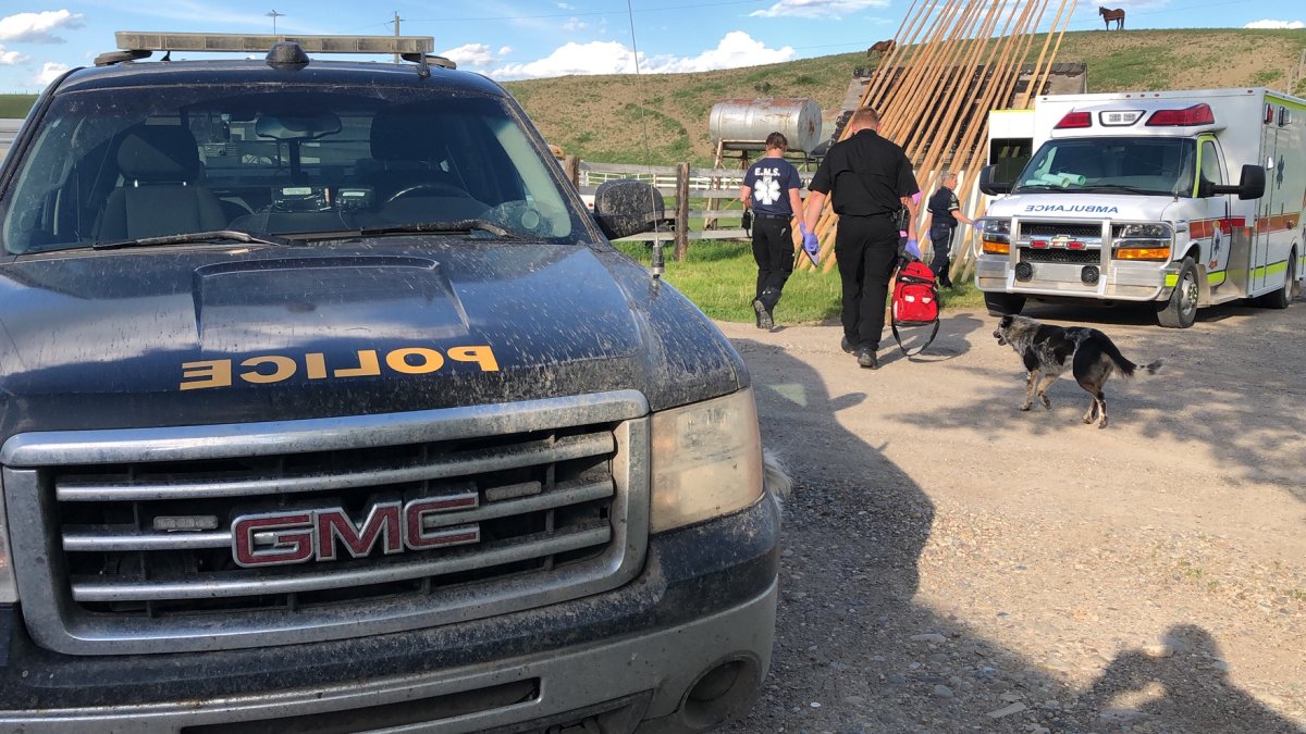 Image of Blood Tribe Police and EMS responding to a call on the reserve.