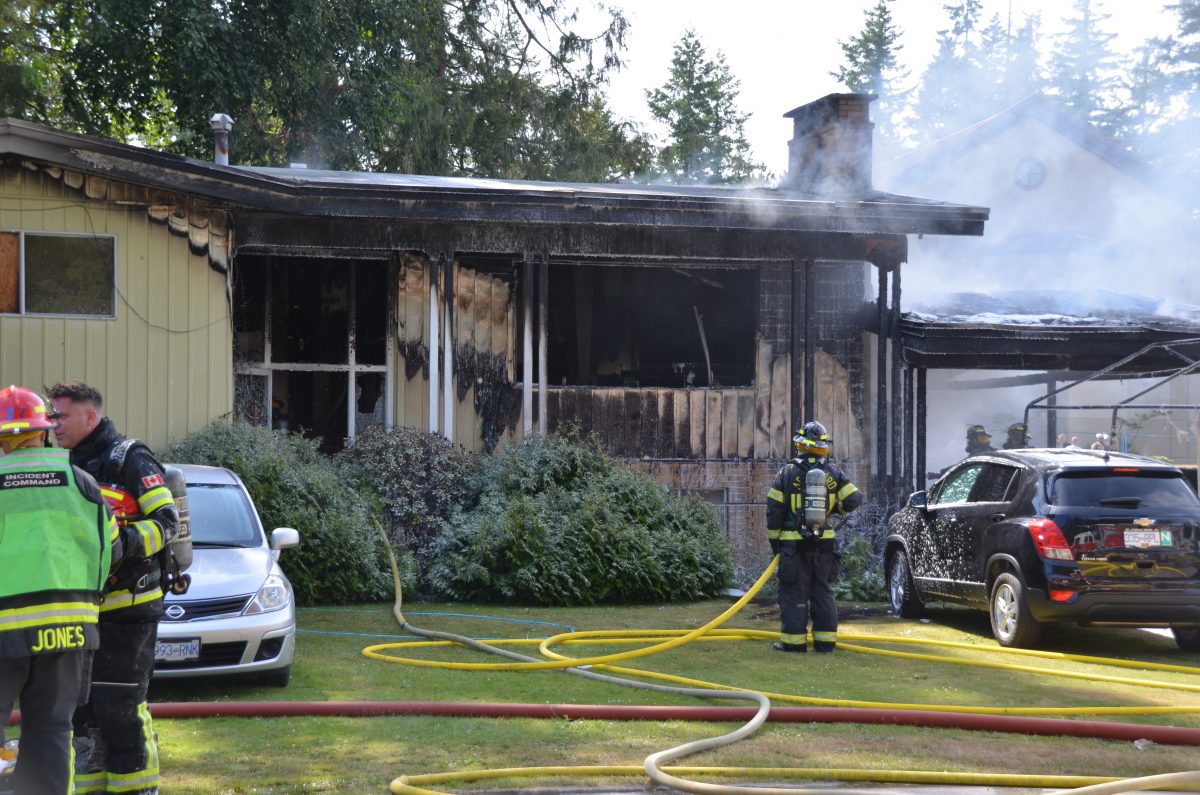 Fire crews tackle a blaze at an Abbotsford home Monday, July 1, 2019.
