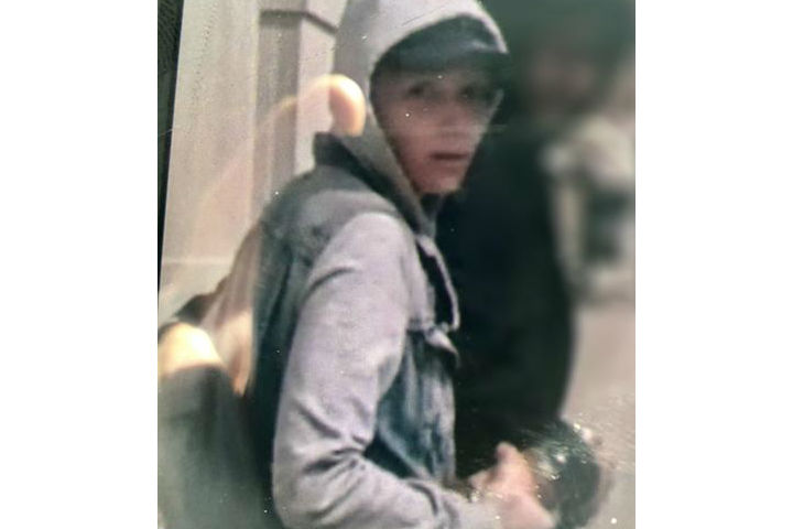 The suspect is described to be between 30 to 39 years old, wearing a denim vest, a grey hoodie, a black baseball hat and blue pants, police say.