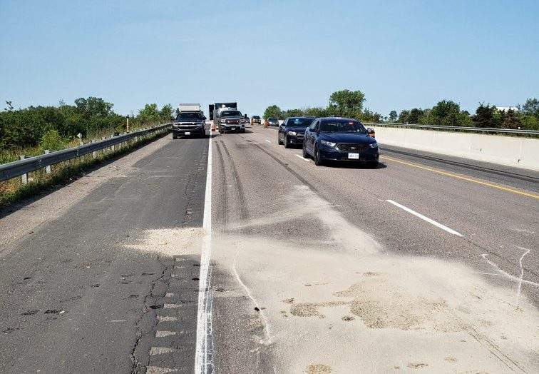 OPP closed two lanes of Highway 401 near Belleville after a tractor-trailer allegedly rear-ended another tractor-trailer on Tuesday morning.
