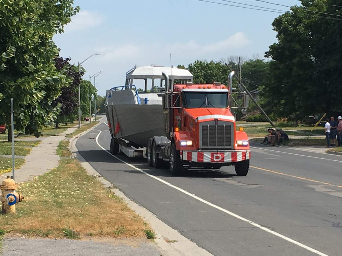 A tranport carrying a large boat allegedly took out several hydro poles and wires, causing a blackout for nearby neighbours.