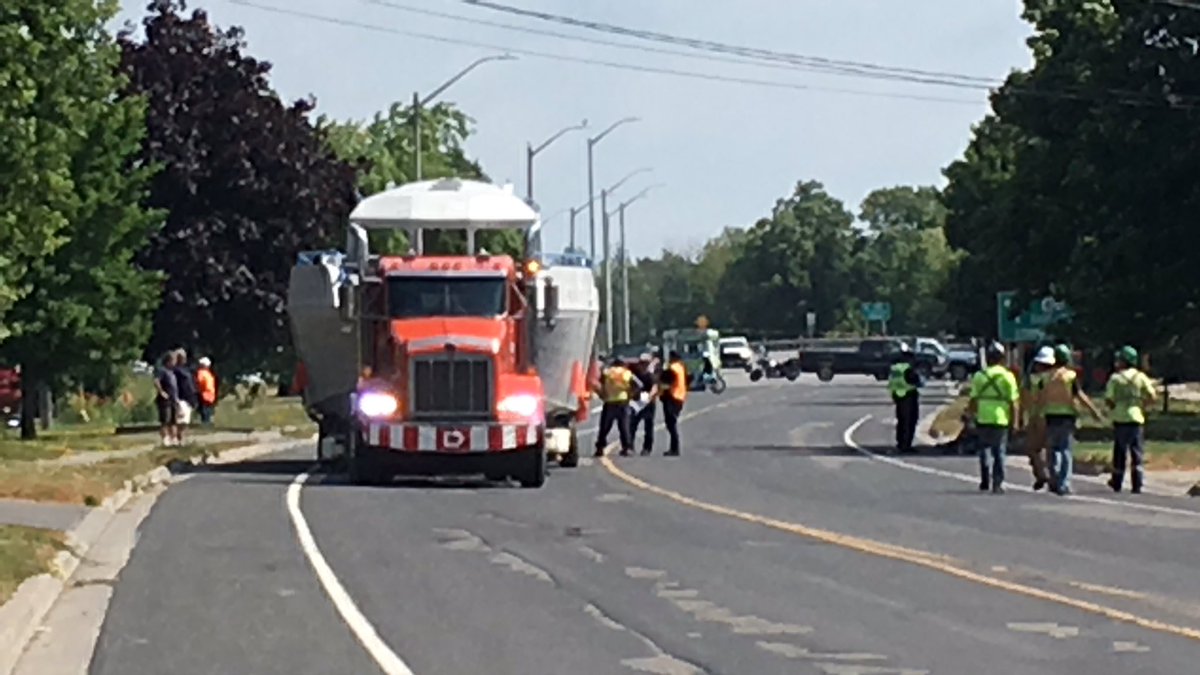 A transport truck carrying a large boat reportedly took out several hydro poles and wires, causing a blackout in Kingston.