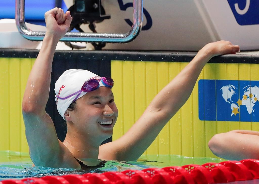 Canada's Margaret MacNeil reacts after winning the women's 100m butterfly final at the world swimming championships in Gwangju, South Korea, Monday, July 22, 2019.