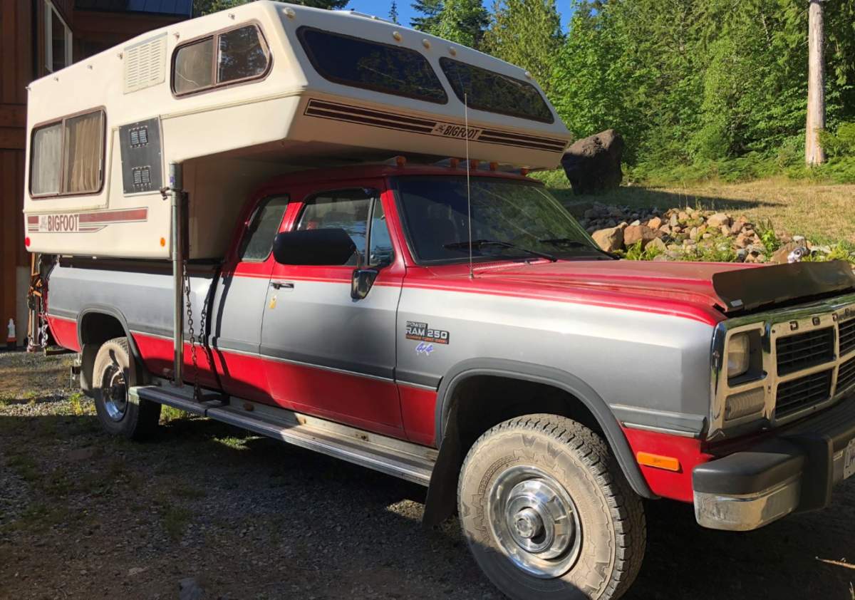 RCMP in northern British Columbia are searching for two young Vancouver Island men whose vehicle was discovered on fire Friday in the same area where police say a body was found.