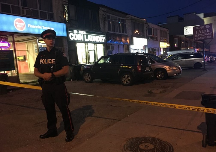 Police block off a plaza after a shooting near Oakwood Avenue and Eglinton Avenue West.
