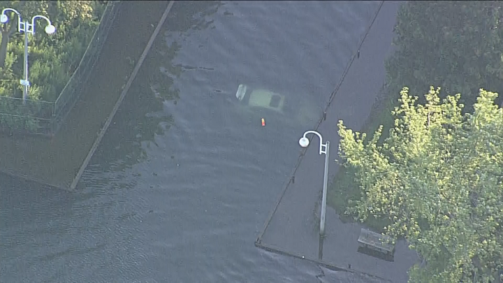 A photo of the car submerged in the lake.