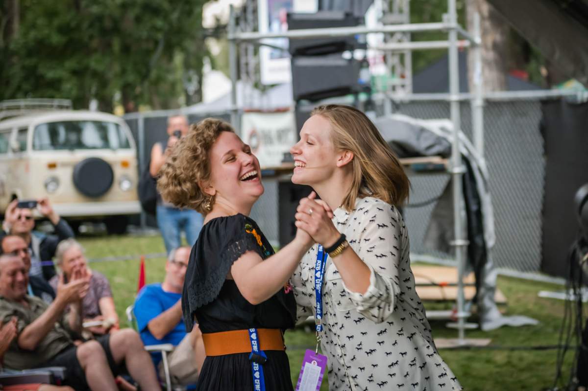 People are seen dancing during a performance at the 2018 Calgary Folk Music Festival.