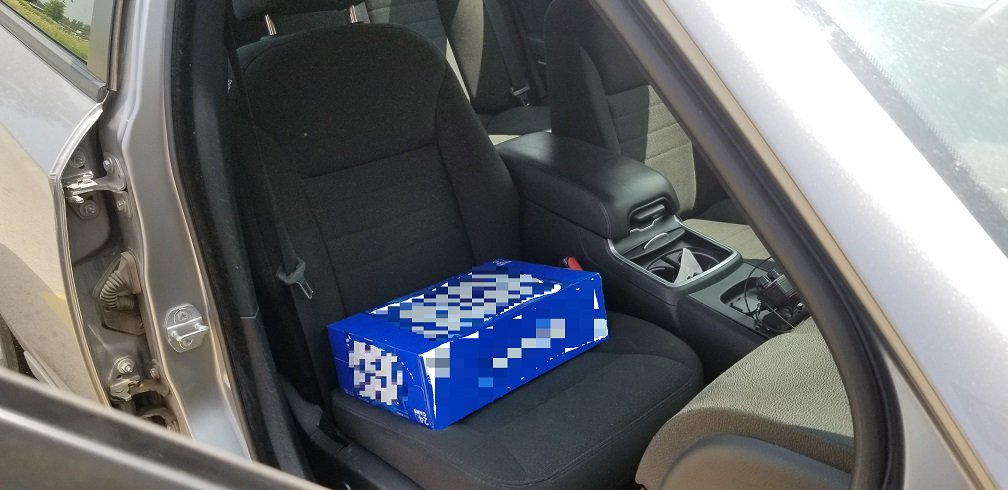 Ontario Provincial Police say a 22-year-old man has been charged after a case of beer was allegedly used as a two-year-old's booster seat.