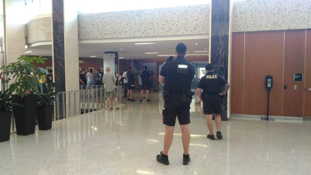 Hamilton police officers look on after a tense meeting of Hamilton's police services board was disrupted by yelling from the public gallery on Wednesday.