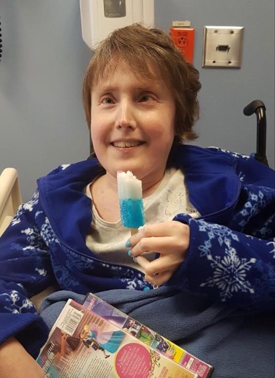 Chrissy Dunnington is seen enjoying a popsicle in hospital in a December 2017 family handout photo. Chrissy Dunnington, 40, died in March 2017, seven weeks after being admitted to hospital.