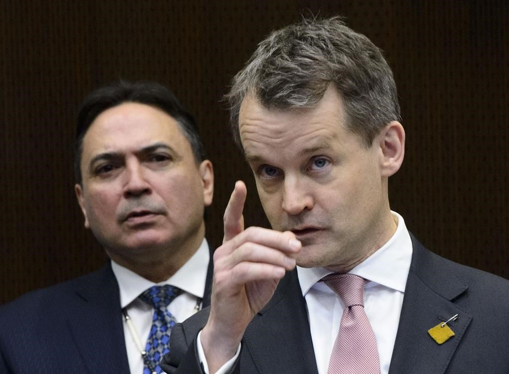 Perry Bellegarde, AFN National Chief, middle, looks on as Indigenous Services Minister, Seamus O'Regan, speaks at a press conference in Ottawa on Thursday, Feb. 28, 2019.