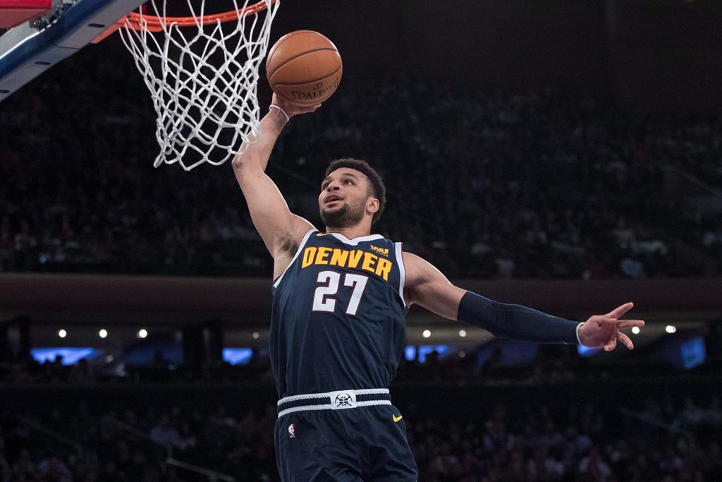 Denver Nuggets guard Jamal Murray goes to the basket during the first half of the team's NBA basketball game against the New York Knicks, Friday, March 22, 2019, at Madison Square Garden in New York. Jamal Murray's breakout NBA season has paid off. The 22-year-old from Kitchener, Ont., agreed to a five-year, US$170 million contract extension with the Denver Nuggets, the richest deal for a Canadian player in NBA history. THE CANADIAN PRESS/AP, Mary Altaffer.