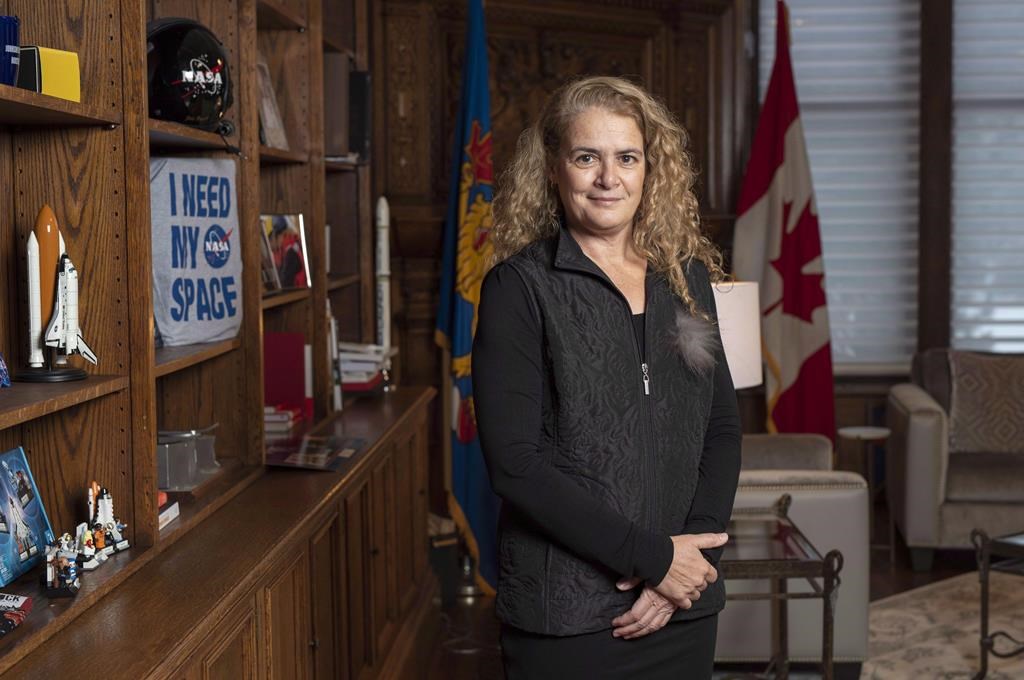 Governor General Julie Payette stands next to a shelf featuring memorabilia from her career as an astronaut, in her office at Rideau Hall in Ottawa on December 11, 2018.The governor general will not be moving in to her official residence this summer, and there is no date for when that might happen.Julie Payette, who is currently staying at Rideau Gate, will not move in to Rideau Hall and that decision will stand "until further notice.".