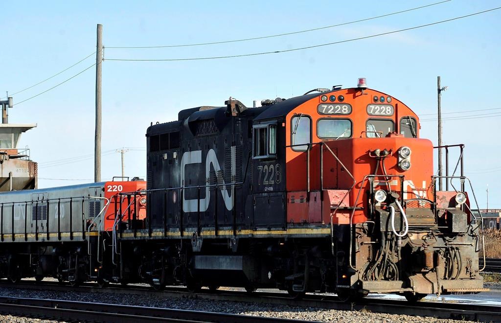 A CN locomotive makes its way through the CN Taschereau yard in Montreal on Nov., 28, 2009. Canadian National Railway says it is on track to move record quantities of western Canadian grain for the year after a strong June.THE CANADIAN PRESS/Graham Hughes.