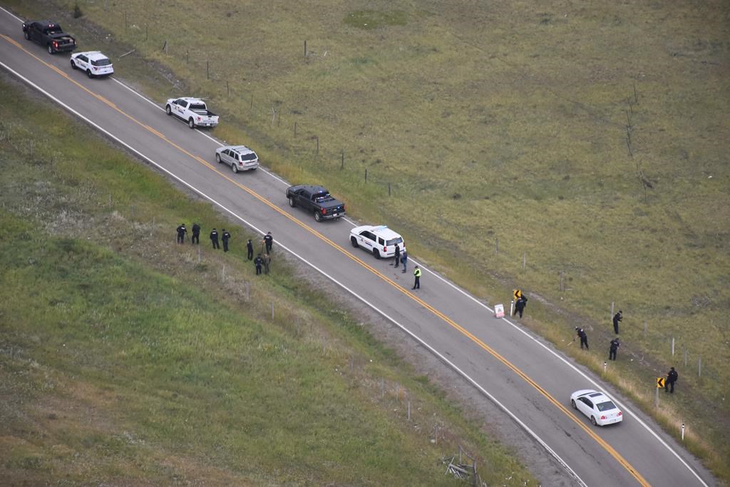 Police investigate the scene of a shooting along Highway 1A near Morley, Alta., in this August 2018 police handout photo.