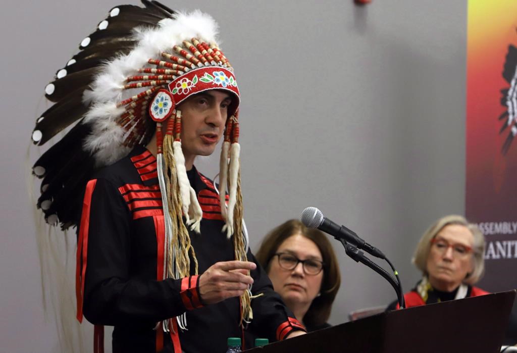 Grand Chief Arlen Dumas (left) speaks during a signing ceremony to improve child and family services in Manitoba First Nations communities, as Indigenous Services Minister Jane Philpot (centre) Northern Affairs Minister Carolyn Bennet look on in Ottawa, Thursday, December 7, 2017. THE CANADIAN PRESS/Fred Chartrand.