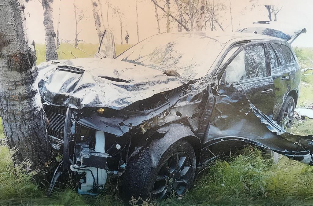 The crashed car of 60-year-old Horst Stewin who was shot in the left side of the head by someone in a passing car is shown in this undated court handout photo.