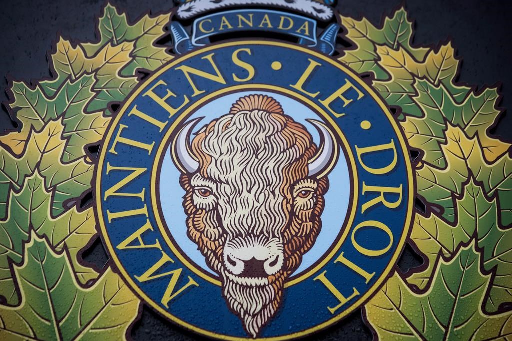 The RCMP logo is seen outside Royal Canadian Mounted Police "E" Division Headquarters, in Surrey, B.C., on Friday April 13, 2018. The federal government is fighting a proposed class-action lawsuit against the RCMP over bullying and intimidation of members, saying the national police force already has a comprehensive policy on harassment and the Mounties have made considerable strides toward modernization. THE CANADIAN PRESS/Darryl Dyck.