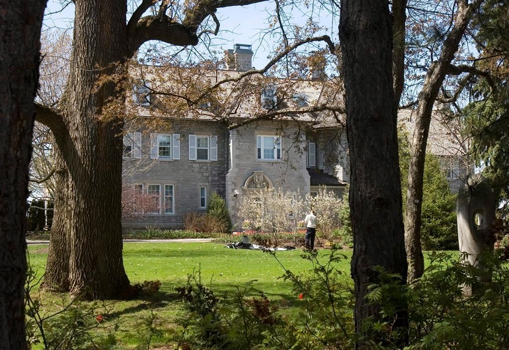 A gardener works on the grounds at the Prime Minister's residence at 24 Sussex Drive in Ottawa, Tuesday May 6, 2008.