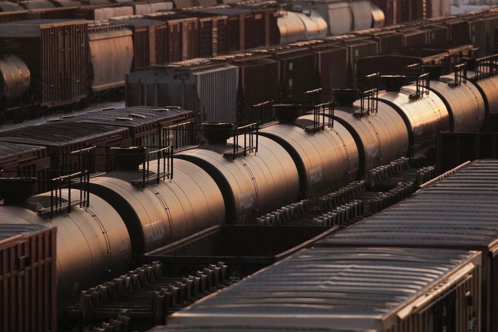 Rail cars are seen in Winnipeg, Sunday, March 23, 2014. Canada's largest oil producers are calling on the Alberta government to reward companies that commit to adding crude-by-rail capacity by easing their curtailment levels. 