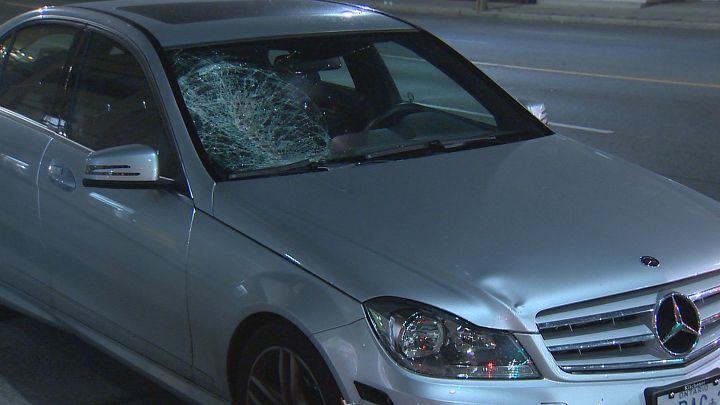 A vehicle with significant damage to its windshield is seen near Avenue Road and Webster Avenue following a collision early Saturday morning.