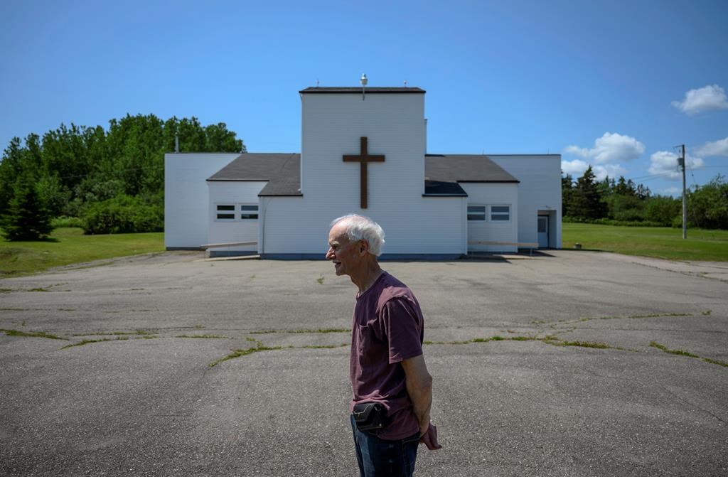 Rod Farrell, a warden at the Church of St. Barra, poses in front of the church closed by the Diocese of Antigonish in Christmas Island, Cape Breton, N.S. on Friday, July 26, 2019. Farrell is part of a renegade group of Roman Catholics defying a bid by the local bishop to shut down their 200-year-old parish following years of declining population and the fallout from a sexual abuse scandal that resulted in a $16-million settlement for 125 confirmed and alleged victims.