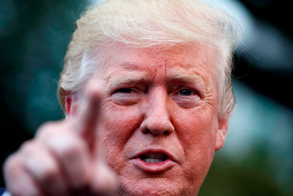 President Donald Trump speaks with reporters on the South Lawn of the White House before departing, Wednesday, July 17, 2019, in Washington.