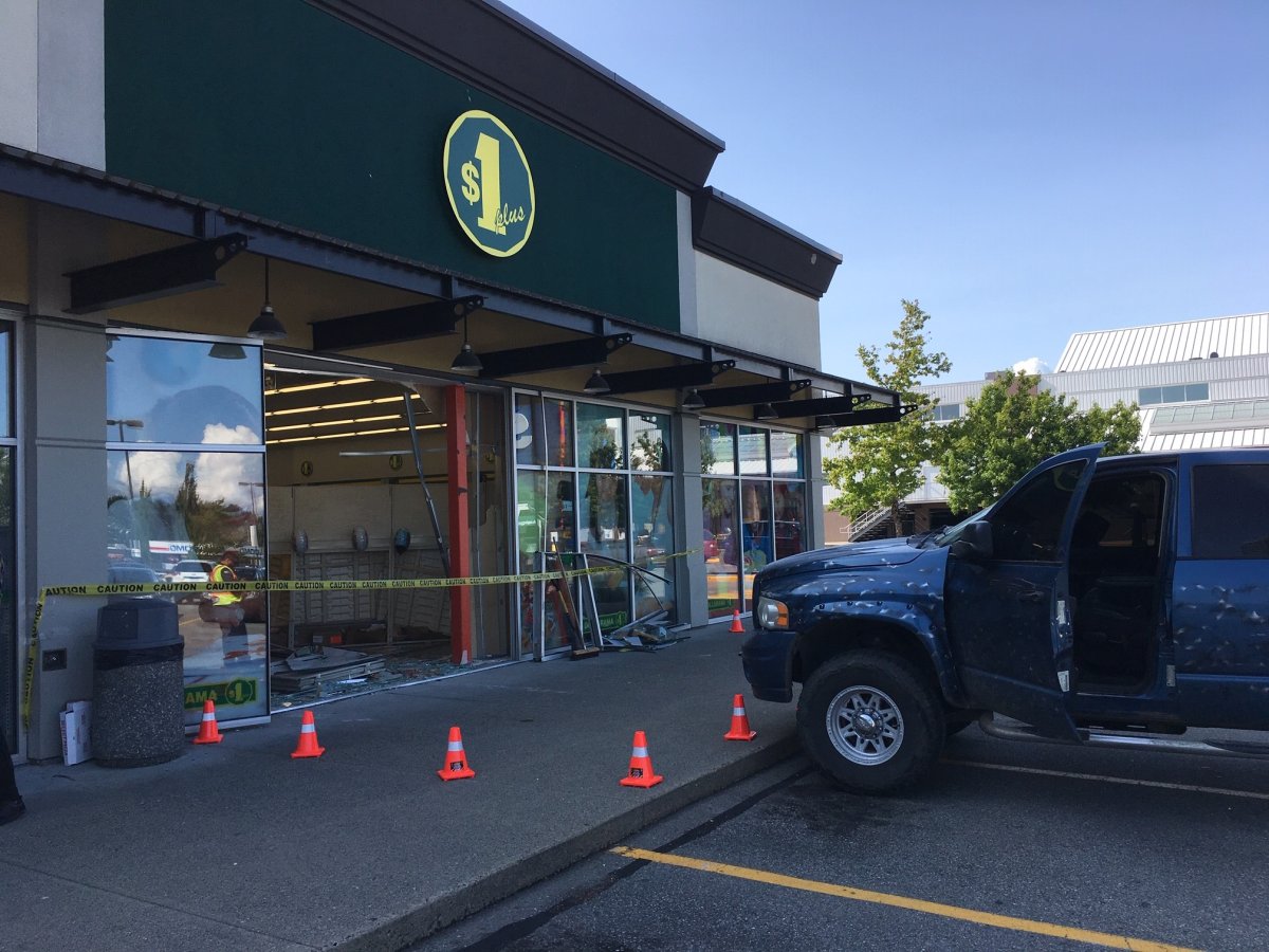 A pickup truck sits outside the hole it created in a Dollarama store in Delta on Saturday, July 13, 2019.
