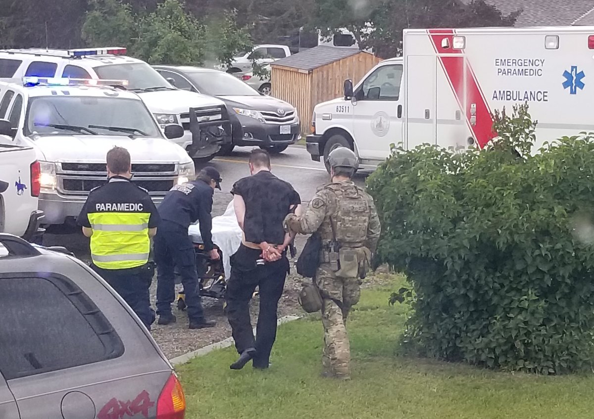 A man is arrested outside a home in Jaffray, B.C. after stealing multiple vehicles while evading police Thursday, July 4, 2019.