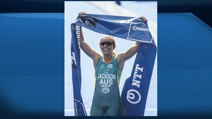 Emma Jackson of Australia crosses the finish line for the win during the Elite Women's event at the ITU World Triathlon Series in Edmonton on Saturday, July 20, 2019. 